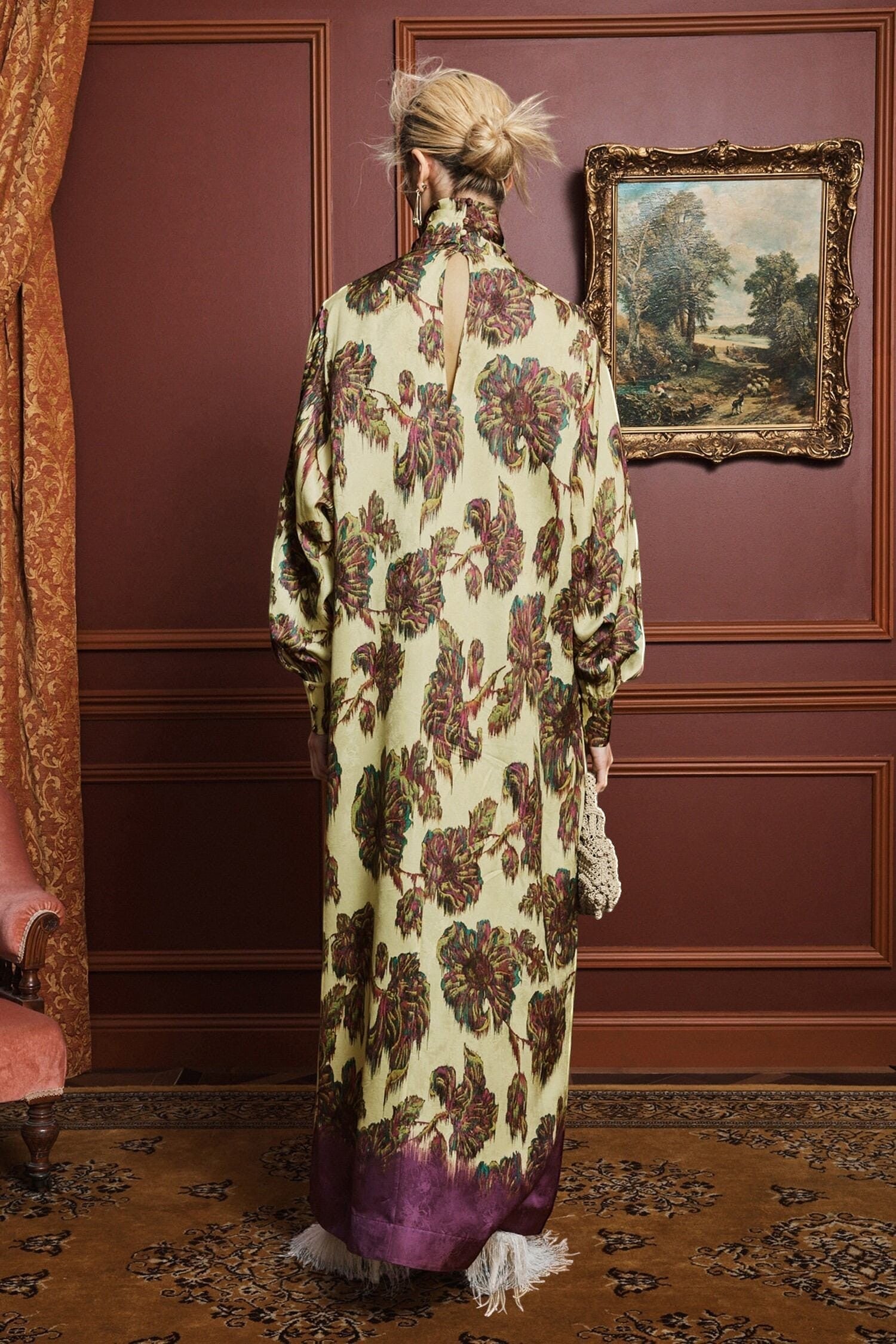 Coats and co. yellow and purple floral print maxi dress with high neck and long sleeves, worn by a model.